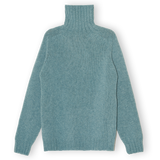 Teal sweater on a white background